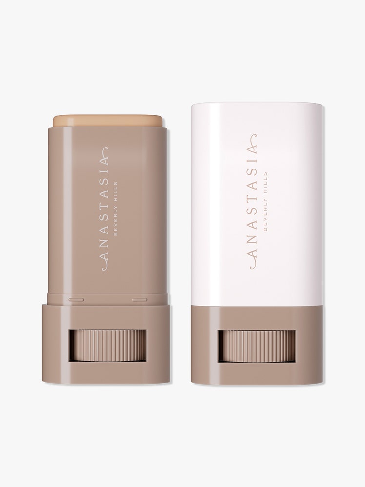 Anastasia Beverly Hills Beauty Balm Serum Boosted Skin Tint white and tan twist up stick of skin tint on light gray background