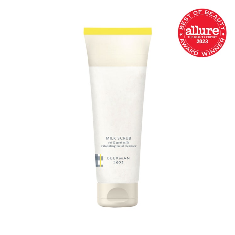 Beekman 1802 Milk Scrub Oat  Goat Milk Exfoliating Cleanser off white tube with yellow stripe on white background with...