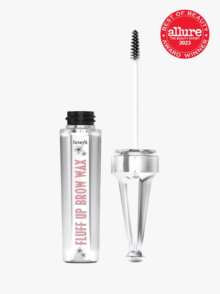 An open slim silver tube of Benefit Fluff Up Brow Wax with a red 2023 Allure Best of Beauty Award seal in the upper-right corner