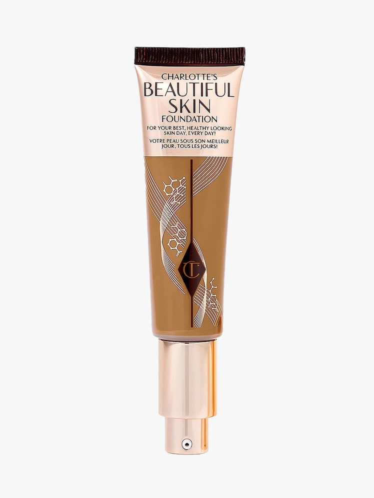 Charlotte Tilbury Beautiful Skin Foundation rose gold and transparent tube of foundation on light gray background