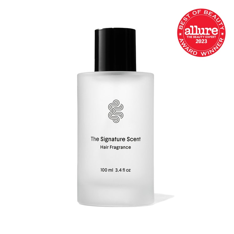 Crown Affair The Signature Scent cloudy transparent cylinder bottle of hair perfume with black cap on white background...