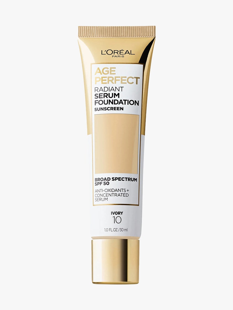 L'Oréal Paris Age Perfect Radiant Serum Foundation gold and white tube of foundation on light gray background