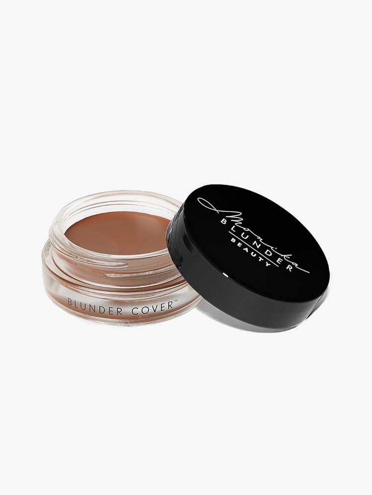 Monika Blunder Blunder Cover All in One Foundation jar of foundation with black lid ajar on light gray background
