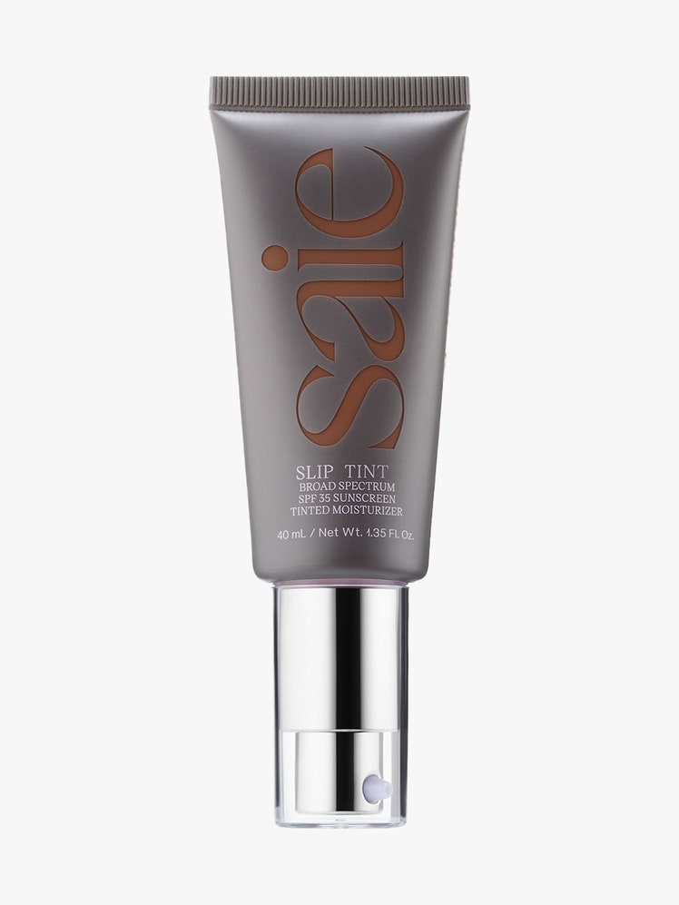 Saie Slip Tint Dewy Tinted Moisturizer SPF 35 Sunscreen gray tube with silver cap on light gray background