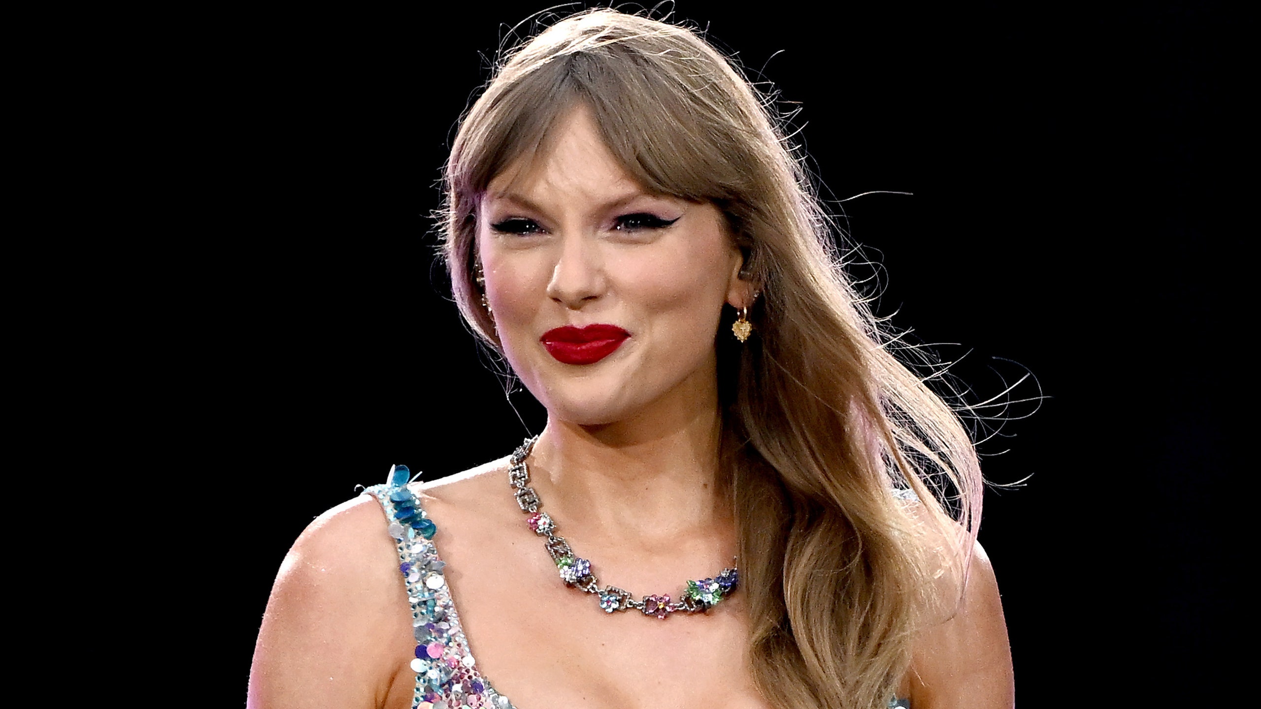 Taylor Swift smiling on stage