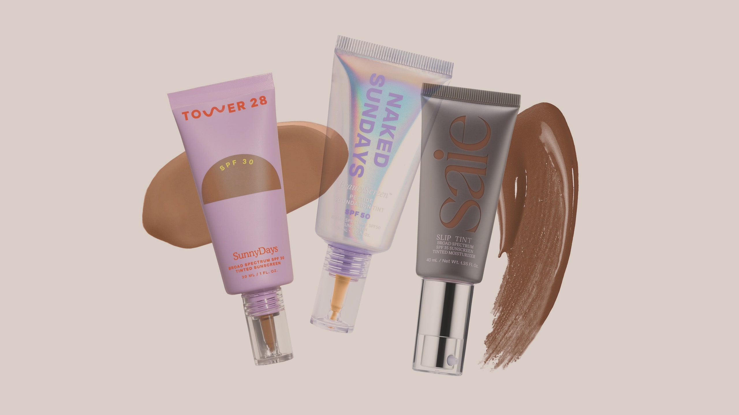 3 cosmetic items overlapping on a beige background. From left to right purple tube with brown cream behind it iridescent...