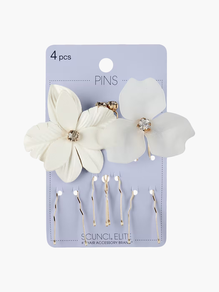 Elite Flower and Rhinestone U Pins in white and gold color way on soft purple branded packaging card on light gray background
