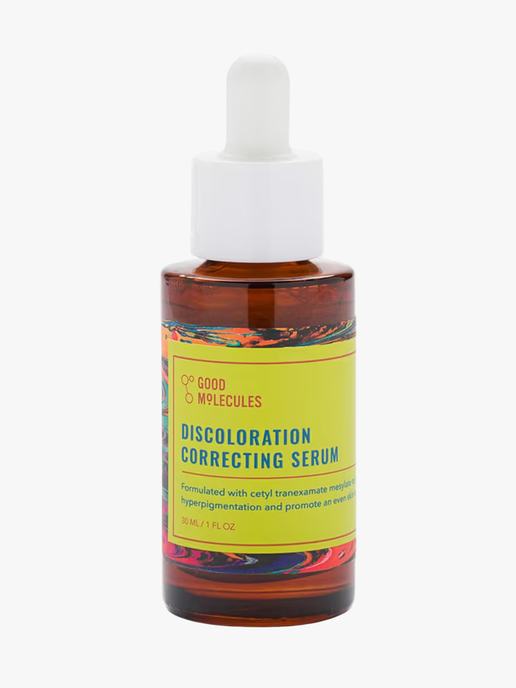 Good Molecules Discoloration Serum in branded amber bottle with white pipette on light gray background
