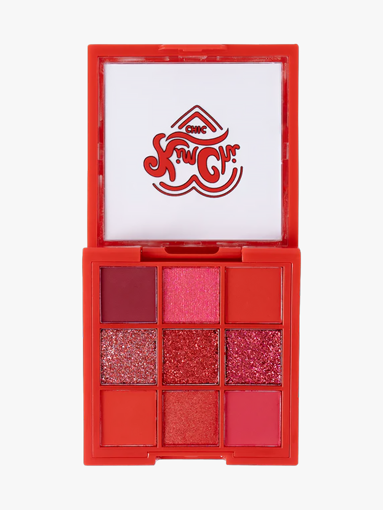 Kim Chi Chic Eyeshadow Palette branded component in ruby on a light gray background
