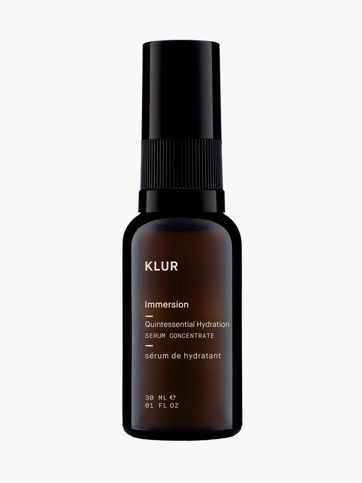 Klur Immersion Serum Concentrate in dark amber bottle with black cap on light gray background
