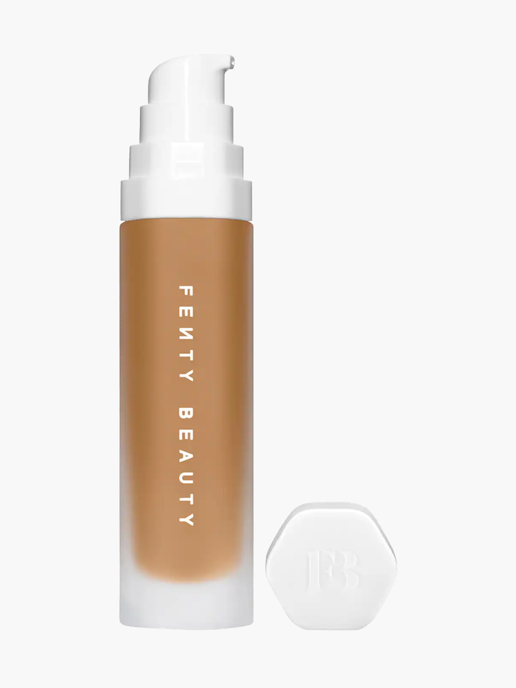 SoftLit Dewy Foundation in branded clear bottle with white pump and silver cap on light gray background