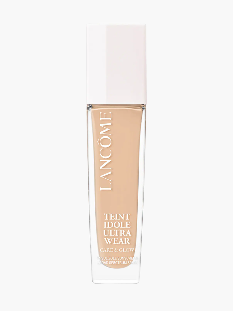 Teint Idole Ultra Wear Care & Glow Foundation in branded clear bottle with white cap on light gray background